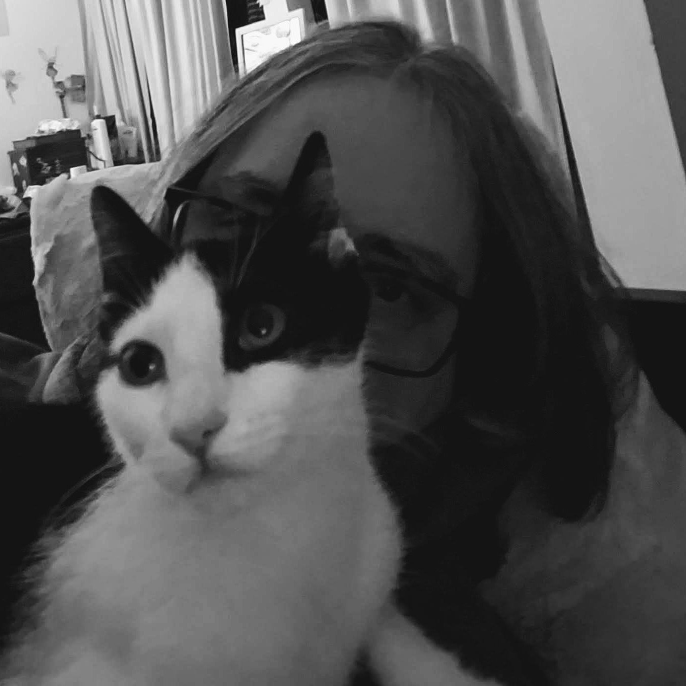 J. A. Bryson, behind a black and white cat